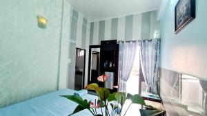 Postel nebo postele na pokoji v ubytování DaLat Sky Hostel