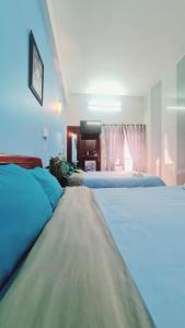 Postel nebo postele na pokoji v ubytování DaLat Sky Hostel