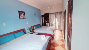 Postel nebo postele na pokoji v ubytování DaLat Sky Hostel