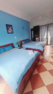 Postel nebo postele na pokoji v ubytování DaLat Sky Hostel