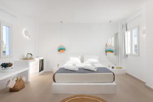 Postel nebo postele na pokoji v ubytování VOCA HOTEL & SUITES + 35 fotografií