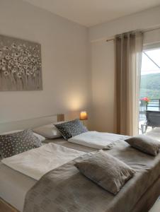 Lova arba lovos apgyvendinimo įstaigoje Apartments Laura - cozy and affordable