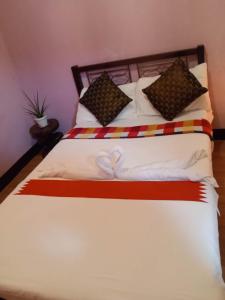 Postel nebo postele na pokoji v ubytování Leigh HomeStay
