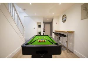 a room with a pool table in a house at Stunning Bolton abode – Pool table – Parking in Bolton