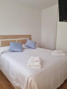 Postel nebo postele na pokoji v ubytování Maile Apartamentos