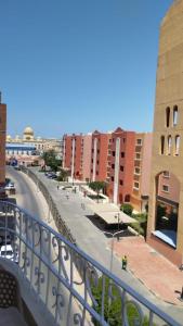 a view of a city street from a balcony at Hurghada's Marina view in Hurghada