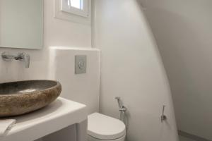 a bathroom with a sink and a toilet at Feel Breeze in Mikonos