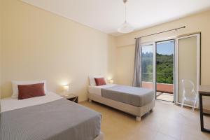 A bed or beds in a room at Luxury Villa Perla
