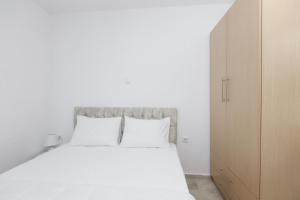 Postel nebo postele na pokoji v ubytování Vergia Apartment 1