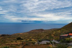 a view of the ocean from a hill at Vivienda vacacional el Aljibe in Mocanal