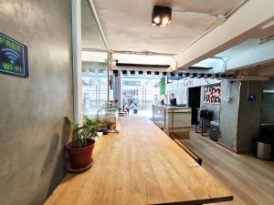 a hallway of a restaurant with a table in a room at Citin Sukhumvit 11 Nana Bangkok by Compass Hospitality in Bangkok +34 photos