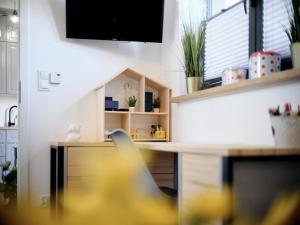 Kuchyň nebo kuchyňský kout v ubytování Villa Łeba Pokoje & Apartamenty