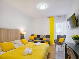 Postel nebo postele na pokoji v ubytování Villa Łeba Pokoje & Apartamenty