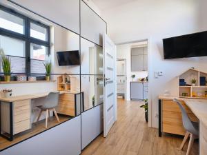 Kuchyň nebo kuchyňský kout v ubytování Villa Łeba Pokoje & Apartamenty