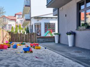 Herní místnost nebo prostor pro děti v ubytování Villa Łeba Pokoje & Apartamenty