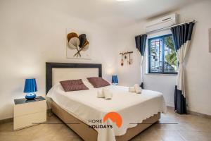 a bedroom with a bed and a window at #120 Sunny Balcony with Pools and Golf Course in Albufeira