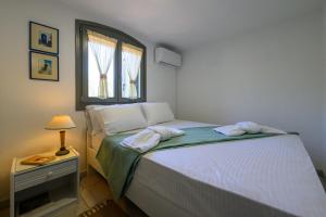Postel nebo postele na pokoji v ubytování Σελήνη