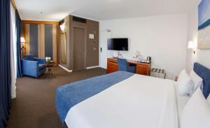 Postel nebo postele na pokoji v ubytování Best Western Plus Congress Hotel Yerevan