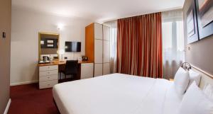 Postel nebo postele na pokoji v ubytování Best Western Plus Congress Hotel Yerevan