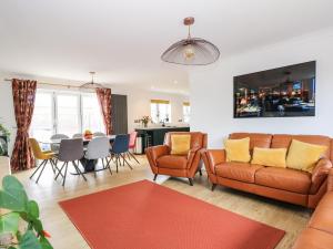 a living room with a couch and a table at Seaview in Lowestoft