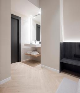 a bathroom with a sink and a mirror at Blanq Ruzafa in Valencia