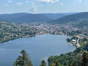 a view of a large lake in a city at Le chalet blanc de Gerardmer avec Spa in Gérardmer