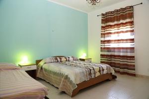 Postel nebo postele na pokoji v ubytování Villa Giù, indipendent villa near airport and sea