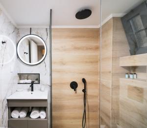 a bathroom with a shower and a sink at Fontem Central Living in Heraklio Town