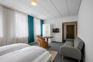 TV a/nebo společenská místnost v ubytování Hotel Annet garni