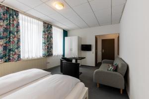 Postel nebo postele na pokoji v ubytování Hotel Annet garni
