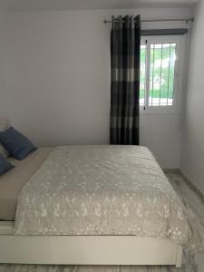 Кровать или кровати в номере Jardines Apartment