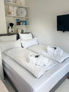 En eller flere senge i et værelse på Studio Apartment Klabbu18 in Strandnähe