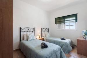 Posteľ alebo postele v izbe v ubytovaní Casa María - Finca Medina