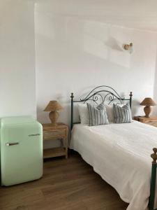 Tempat tidur dalam kamar di Casa da Nazaré