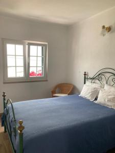 Tempat tidur dalam kamar di Casa da Nazaré
