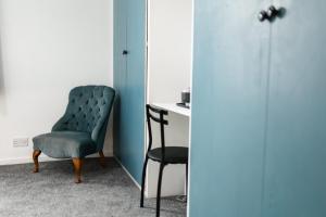 a room with a chair and a desk at Pearson Park Rooms in Hull