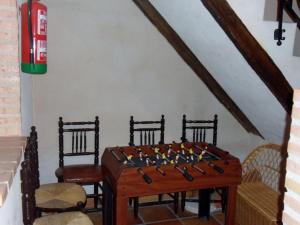 a room with a table with a chess board on it at Casa Rural Santa Rita in Mota del Cuervo