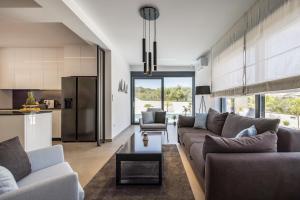 a living room with a couch and a table at Villa Levant in Murter