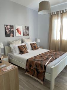 Postel nebo postele na pokoji v ubytování Villa Tranquilita