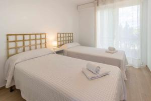 Posteľ alebo postele v izbe v ubytovaní Port de Llançà 29 Apartamento con vistas al mar