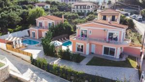 an aerial view of a house with a swimming pool at Villa Danae in Laganas
