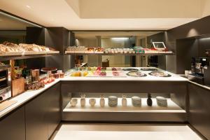 a bakery with a lot of food on display at Hotel Denit Barcelona in Barcelona
