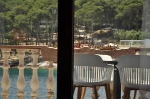 a view of a balcony with a table and chairs at Jungle & Sea Boxavia in Božava