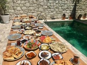 a long table with a lot of food on it at Warszawski Alaçatı in Alaçatı