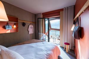 Postel nebo postele na pokoji v ubytování MOB HOTEL Lyon Confluence