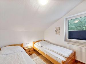 Postel nebo postele na pokoji v ubytování Ferienhaus Birkenlund