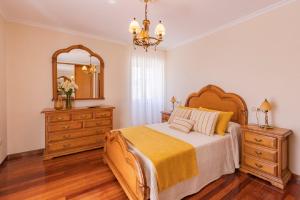 A bed or beds in a room at Casa Bértolo