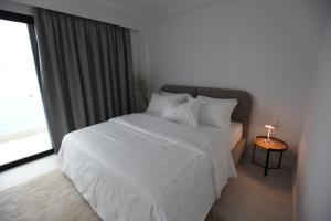 Postel nebo postele na pokoji v ubytování Swiss Rivage Hotel