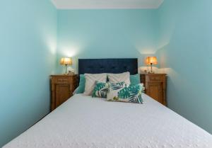 A bed or beds in a room at Casa Bértolo