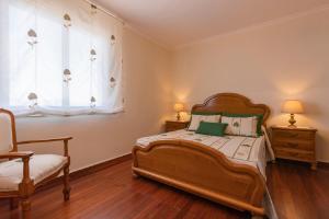 A bed or beds in a room at Casa Bértolo